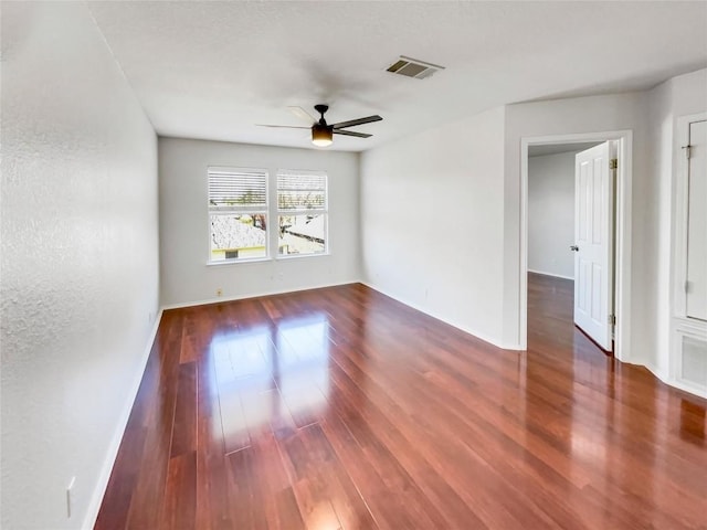 3128 Flinders Reef Ln, Austin, TX 78728 - unfurnished room featuring a ceiling fan and dark wood finished floors