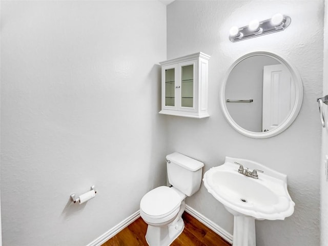 3128 Flinders Reef Ln, Austin, TX 78728 - bathroom featuring wood finished floors and toilet