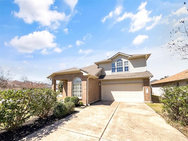 traditional-style home featuring a garage, brick siding, driveway, and roof with shingles