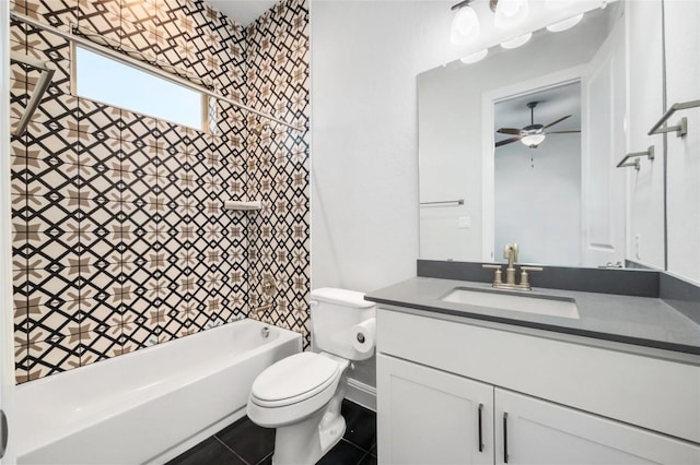 bathroom with toilet, a ceiling fan, washtub / shower combination, tile patterned flooring, and vanity