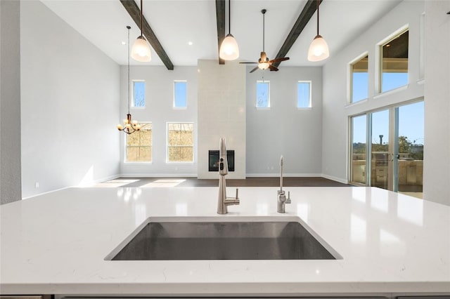 802 Serene Estates Dr, Austin, TX 78738 - kitchen featuring a sink, beamed ceiling, open floor plan, and pendant lighting