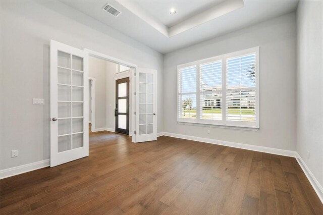 802 Serene Estates Dr, Austin, TX 78738 - spare room featuring french doors, dark wood finished floors, a tray ceiling, and recessed lighting