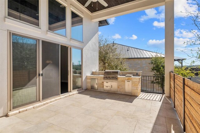 view of patio with a sink, area for grilling, an outdoor kitchen, and ceiling fan