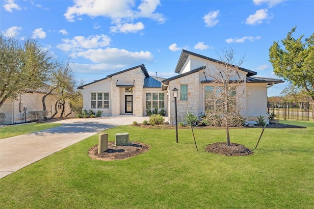 802 Serene Estates Dr, Austin, TX 78738 - view of front of property featuring stone siding, a standing seam roof, concrete driveway, metal roof, and stucco siding