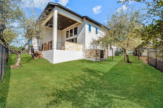 802 Serene Estates Dr, Austin, TX 78738 - back of property featuring stone siding, stucco siding, and ceiling fan