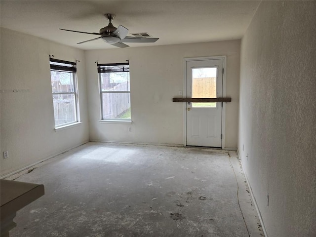 spare room with a ceiling fan