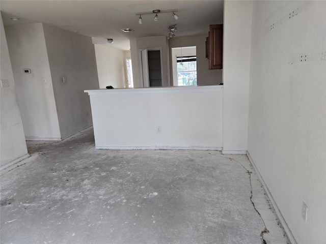 empty room featuring unfinished concrete floors