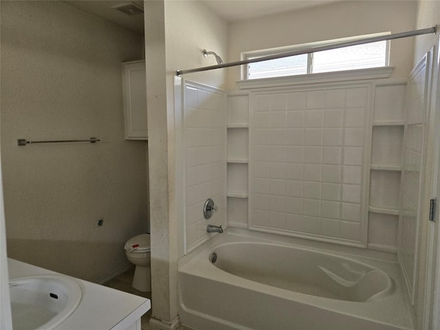 full bath with visible vents, vanity, toilet, and bathing tub / shower combination