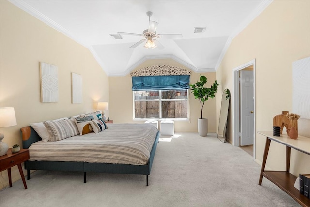 bedroom featuring visible vents, crown molding, lofted ceiling, and carpet floors