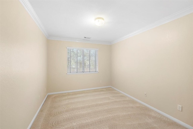 empty room with baseboards, light carpet, and crown molding