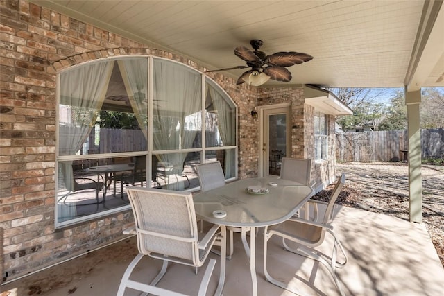 view of patio / terrace featuring outdoor dining area, ceiling fan, and fence