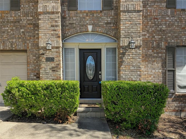 property entrance with brick siding