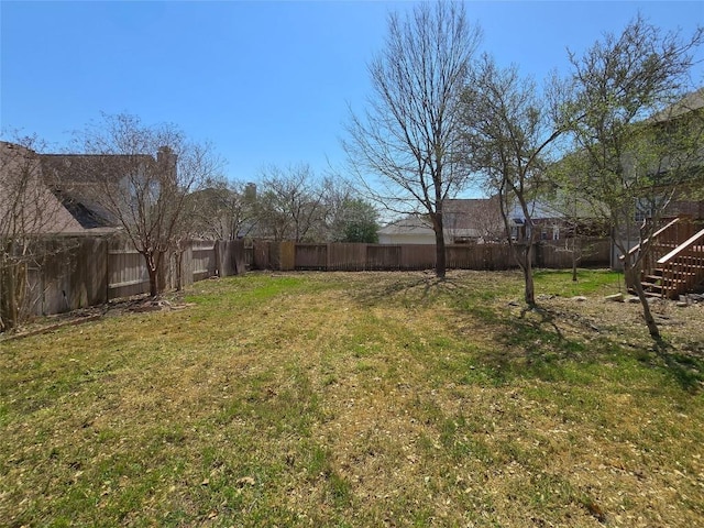 view of yard featuring a fenced backyard