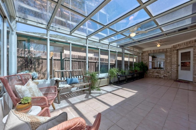 unfurnished sunroom with a ceiling fan