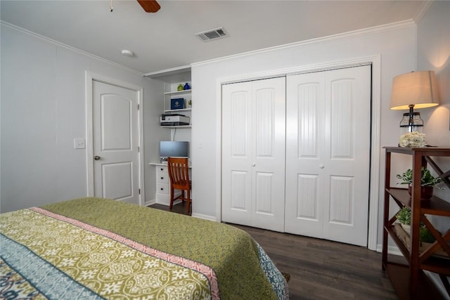 bedroom featuring a ceiling fan, visible vents, dark wood finished floors, ornamental molding, and a closet