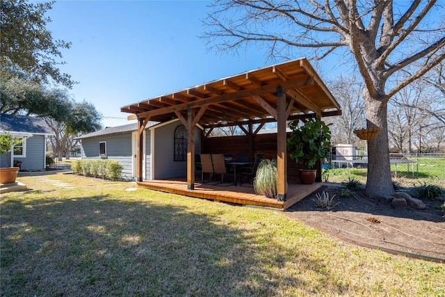 exterior space with a lawn and fence