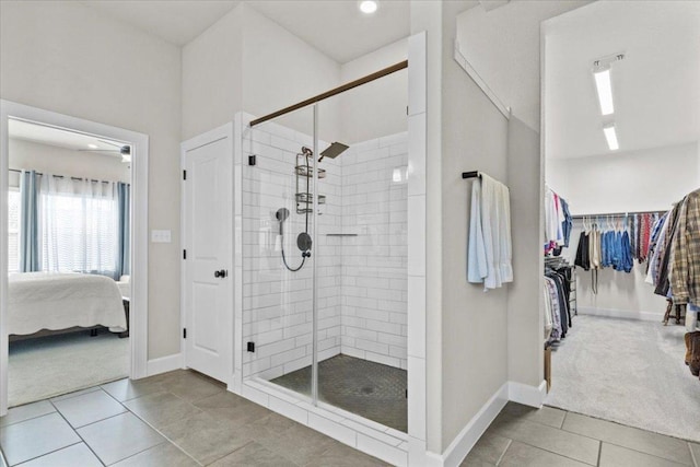 107 Freeman Day Dr, Bastrop, TX 78602 - bathroom featuring a stall shower, baseboards, tile patterned floors, and recessed lighting