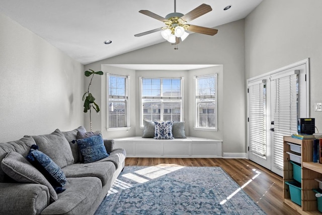 living area featuring a ceiling fan, wood finished floors, recessed lighting, baseboards, and vaulted ceiling