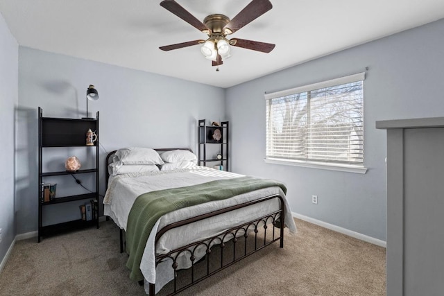 bedroom with baseboards, carpet floors, and ceiling fan