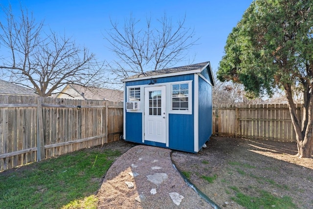 view of shed with a fenced backyard