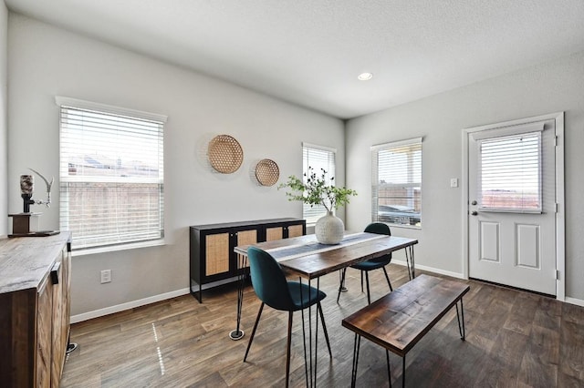 dining room with dark wood-style floors and baseboards