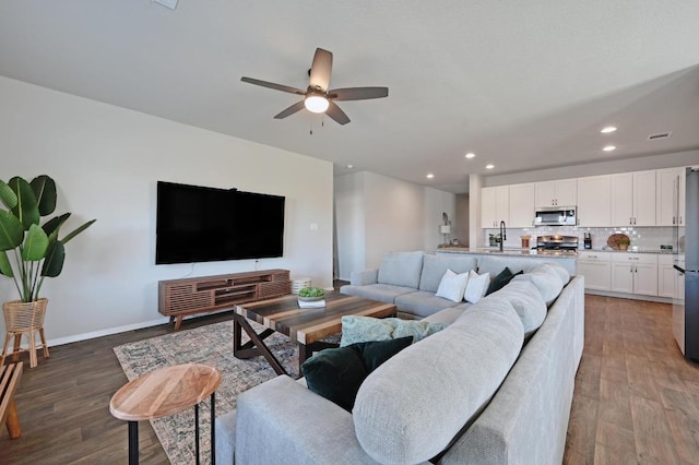 11724 Domenico Cv, Austin, TX 78747 - living area featuring a ceiling fan, wood finished floors, and recessed lighting