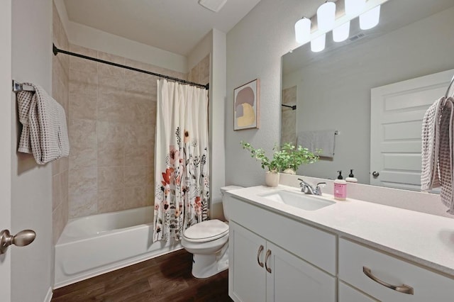 bathroom with vanity, shower / bath combination with curtain, toilet, and wood finished floors