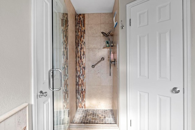 full bath featuring a shower stall