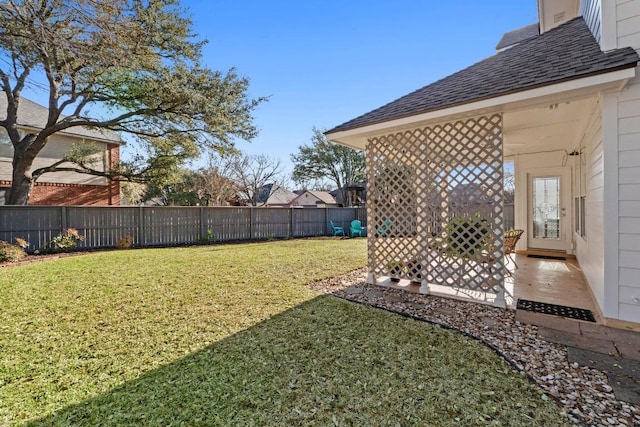 view of yard with a patio and a fenced backyard