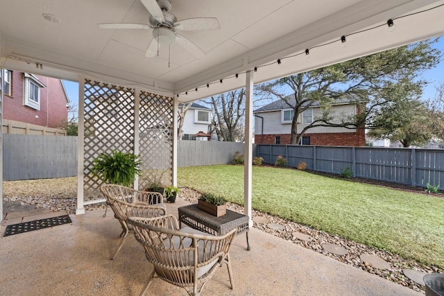 view of patio / terrace with a fenced backyard and ceiling fan