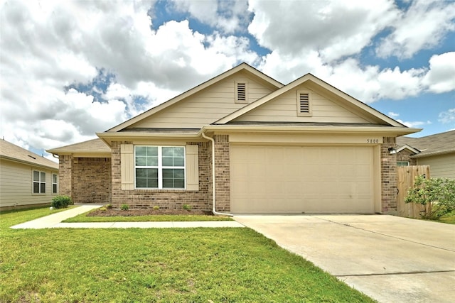 view of front of house with a front lawn, brick siding, concrete driveway, and an attached garage