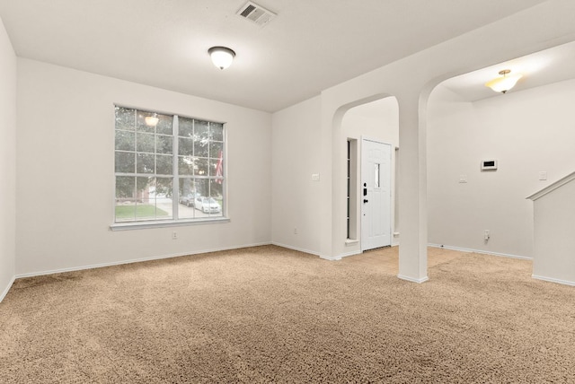 9812 Cow Page Ct, Temple, TX 76502 - carpeted empty room featuring visible vents, arched walkways, and baseboards