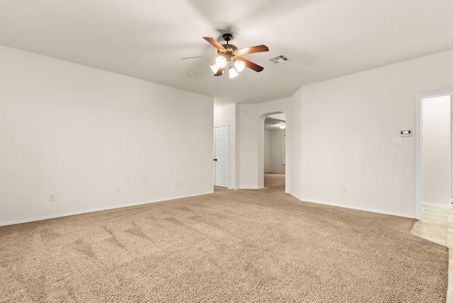9812 Cow Page Ct, Temple, TX 76502 - unfurnished room featuring a ceiling fan, baseboards, visible vents, arched walkways, and light carpet