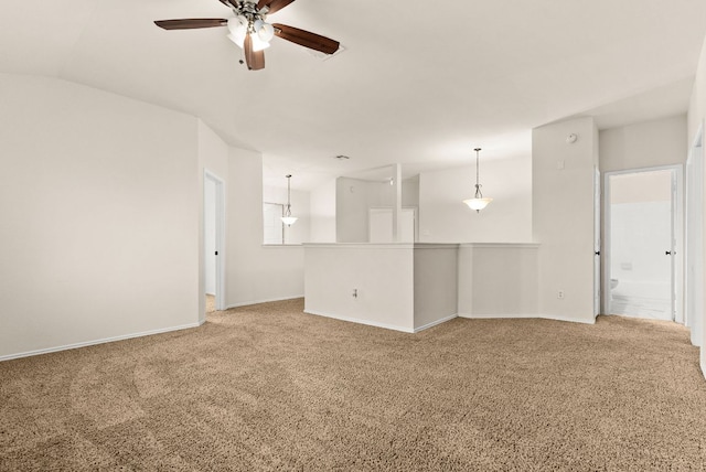 9812 Cow Page Ct, Temple, TX 76502 - unfurnished living room featuring light colored carpet, baseboards, lofted ceiling, and a ceiling fan