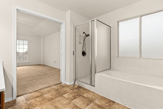 9812 Cow Page Ct, Temple, TX 76502 - bathroom featuring a bath, a shower stall, and baseboards