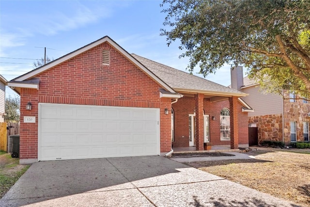 ranch-style home featuring roof with shingles, a chimney, concrete driveway, a garage, and brick siding