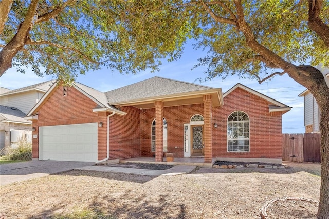 single story home with brick siding, a shingled roof, fence, a garage, and driveway