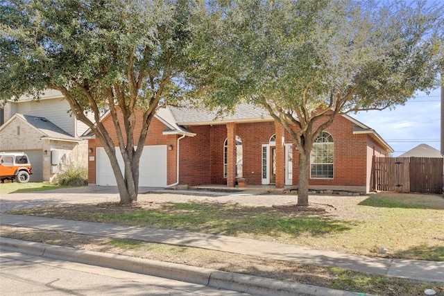 single story home featuring fence, driveway, a shingled roof, a garage, and brick siding