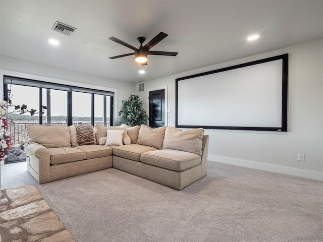 carpeted cinema room featuring ceiling fan, baseboards, and recessed lighting