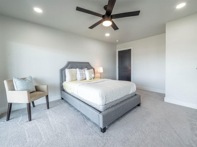 bedroom featuring light carpet, baseboards, recessed lighting, and ceiling fan