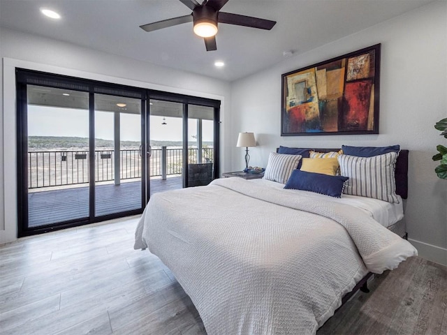bedroom with access to outside, light wood-style floors, recessed lighting, and a ceiling fan