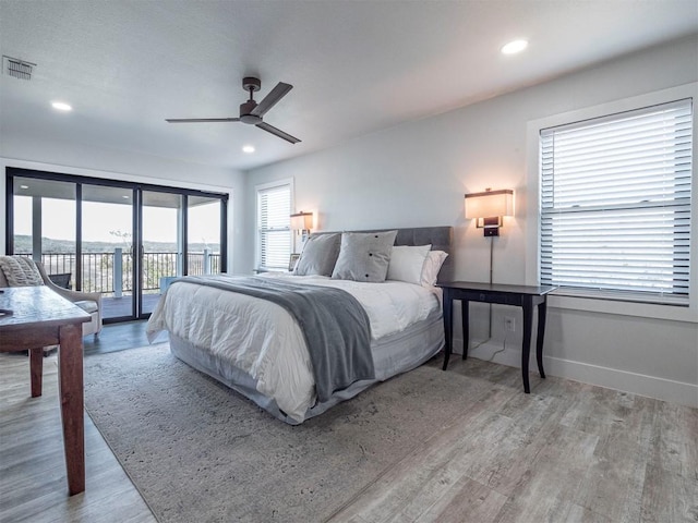 bedroom featuring access to outside, baseboards, wood finished floors, recessed lighting, and a ceiling fan
