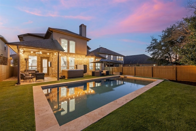 view of pool with a fenced in pool, a yard, a fenced backyard, a patio area, and a jacuzzi