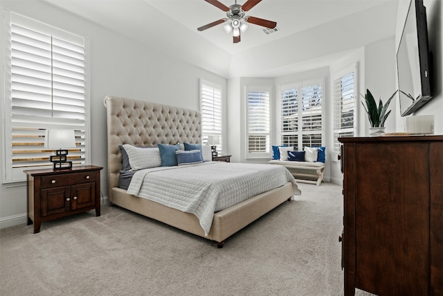 bedroom with baseboards, light carpet, visible vents, and a ceiling fan