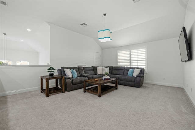 living area with lofted ceiling, recessed lighting, light colored carpet, and visible vents