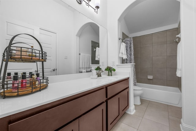 bathroom with toilet, shower / bath combo, vanity, and tile patterned flooring