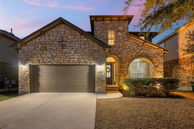 view of front facade featuring concrete driveway and a garage