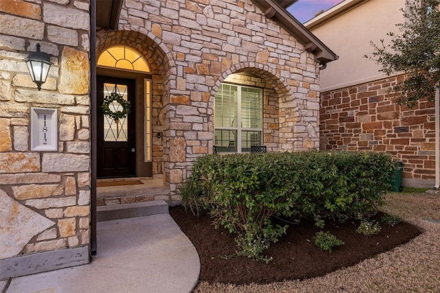 view of exterior entry with stone siding