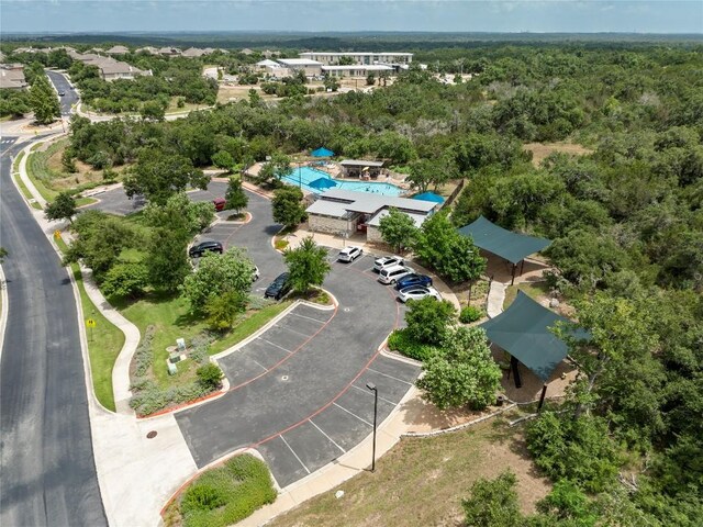 drone / aerial view featuring a view of trees