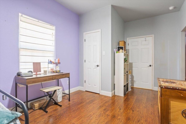 office area featuring wood finished floors and baseboards